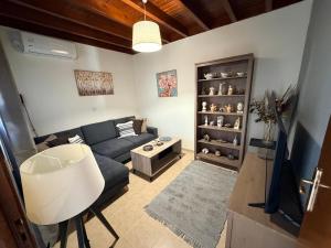 a living room with a couch and a table at GIANNIS HOUSE in Rhodes Town