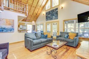 a living room with two couches and a table at Secluded White River Haven! 4 Mi to Devil's Knob in Melbourne
