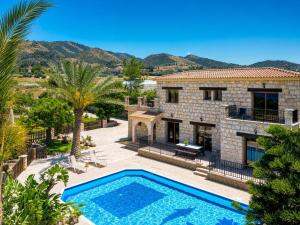 an image of a villa with a swimming pool at Villa Chrisandria in Argaka