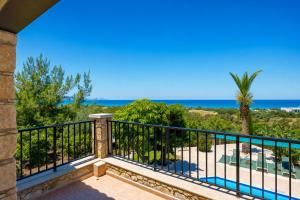 a balcony with a view of the ocean at Villa Chrisandria in Argaka