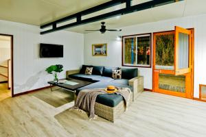 a living room with a couch and a table at Wine Down in Agnes Water