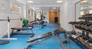 a gym with several treadmills and exercise machines at Nordic Retreat Quiet Oasis in Oslo in Oslo
