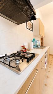 a kitchen with a stove top oven in a kitchen at Casa Garzoglio in Noli