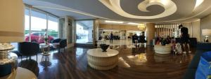 a lobby with people walking around in a building at Estor Staycation in Manila +30 photos
