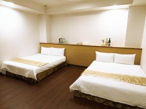 Postel nebo postele na pokoji v ubytování Yi Pin Yuan Hotel