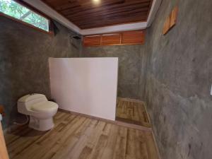 a bathroom with a toilet in a room at Boana hotel in Palomino +24 photos