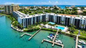 an aerial view of a resort with a marina at Waterfront Island Oasis! Heated Pool with Stunning View & 2 Full Bath in Marco Island