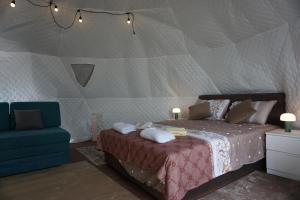 a bedroom with a bed in a tent at Glamping Krupac Lake in Blaca
