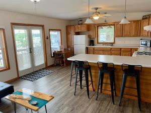 a kitchen with a large island in the middle at Mississippi River Cabin in Bellevue