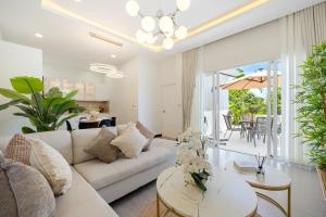 a living room with a couch and a table at Villa Kiru in Koh Samui