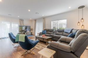 a living room with a couch and a table at 19 Broadway in Martinborough