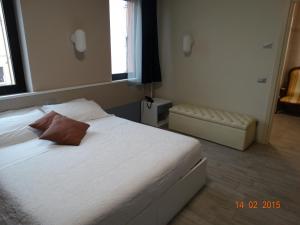 Postel nebo postele na pokoji v ubytování Hotel Moderno