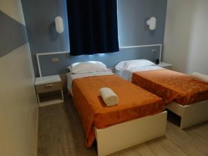 Postel nebo postele na pokoji v ubytování Hotel Moderno