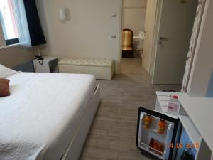 Postel nebo postele na pokoji v ubytování Hotel Moderno