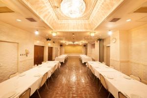 Postel nebo postele na pokoji v ubytování Fujinomiya Green Hotel