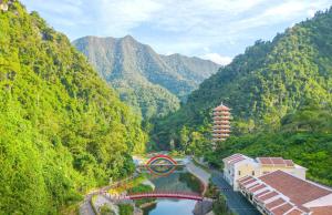 a view of a river in a valley with mountains at Đại Thắng Hotel in Danang