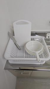 a white tray with a plate and a knife at 奄美ザナゼステイTheNazeStay in Amami +44 photos