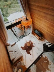 an overhead view of a living room with a glass floor at Cabana dos Colibris in Santa Teresa +63 photos