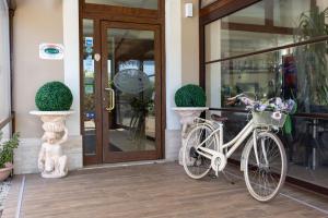 a bike parked in front of a store door at Hotel La Quercia in Valmontone