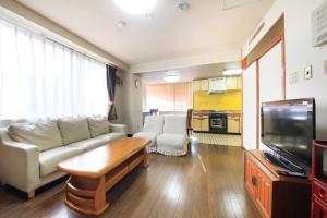 Kuchyň nebo kuchyňský kout v ubytování Fujinomiya Green Hotel