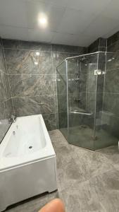 a bathroom with a shower and a sink at Văn Lâm Hotel in Ðình Dù