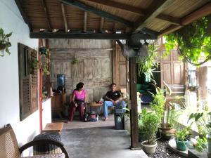 a group of people sitting in a patio at Villatik in Timuran