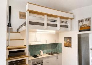 a kitchen with a loft bed in a kitchen at Binishell Igloo 6 - Famous Beachfront Dome with Pool in Trinity Beach +19 photos