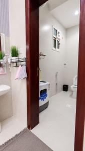 a bathroom with a toilet and a sink at وحدات سكنية الشفا in Khamis Mushayt +6 photos