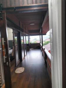 an empty room with a view of a room with a hallway at Pong Elak 'Guest House in Rantepao +5 photos