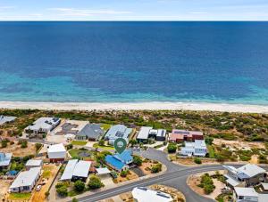 an aerial view of a beach with houses and the ocean at Ocean Blue View in Capel