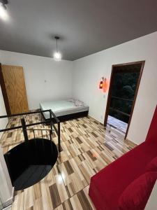 a living room with a couch and a table at Catavento in Paty do Alferes