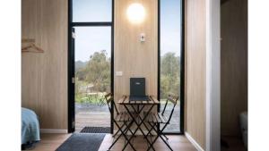 a room with a desk with a laptop on it at Churinga Orchards by Tiny Away in Lenswood