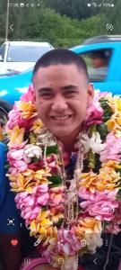 a man is wearing a necklace of flowers at TEMATAOAVEA Dortoir in Fare