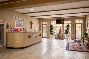 a lobby of a hotel with a reception desk at Arda Karvon Saroy in Khiva +115 photos