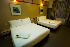 Katil atau katil-katil dalam bilik di Akar Hotel Jalan TAR