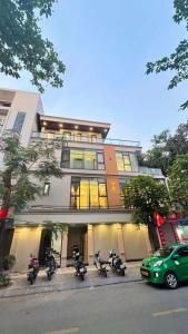 a group of motorcycles parked in front of a building at Nâu Homestay in Hai Phong +8 photos