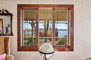 a window with a view of the water at Grammy's Famous Lake House Retreat in East Hampton
