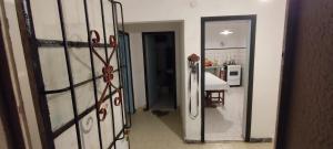 a door leading to a kitchen with a table at Quinta Rancho Pingos in General Rodríguez