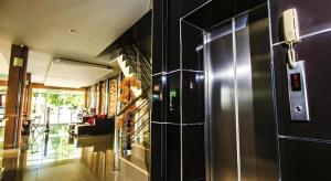 a living room with a refrigerator in a room at Mukdaview Hotel in Mukdahan