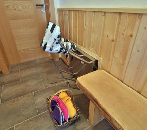 a small room with a bench and a machine at Appartement Haus Tanja in Haus im Ennstal