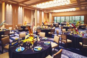 a large banquet room with tables and chairs at Hotel Indigo Inuyama Urakuen Garden by IHG in Inuyama +174 photos