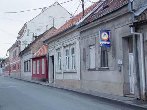 an empty street in a town with buildings at Hostel Kavala in Belgrade