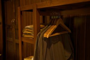 a wooden shelf with towels on it in a room at Baan Phraya Suren บ้านพระยาสุเรนทร์ in Ban Thab Mak +51 photos
