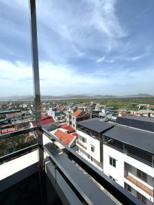 a view of a city from a building at Paloma Hotel Quan Lan in Quan Lạn