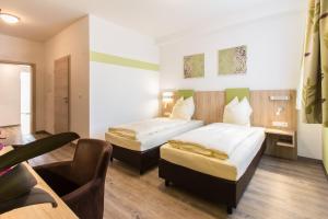 Postel nebo postele na pokoji v ubytování Wasmayr Hof + 29 fotografií