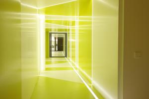 a room with a hallway with lights on the wall at Cosmo Apartments Passeig de Gràcia in Barcelona