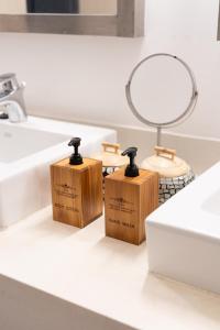 a bathroom with three wooden boxes on a counter at The Cosy New Appartement Fisherman in Bophut +43 photos