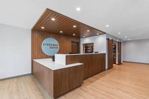 a lobby with a reception counter in a store at Everhome Suites Georgetown - Austin in Georgetown
