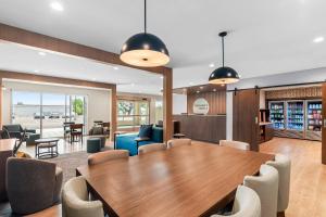 a conference room with a wooden table and chairs at Everhome Suites Georgetown - Austin in Georgetown