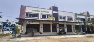 a building with motorcycles parked in front of it at Santha Residency in Ambātturai